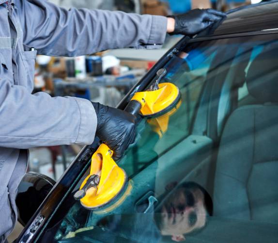 Man Doing Windscreen Replacement 